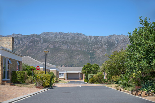 Summervale’s peaceful streets with the Gordon’s Bay mountains beyond
